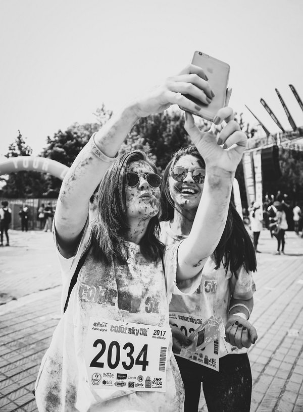 two women runners taking a muddy selfie after the mad runners championship